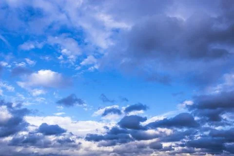 Dramatic thunderstorm clouds background at blue sky Stock Photos