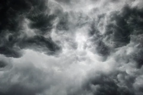 Dramatic thunderstorm clouds background at dark sky Stock Photos