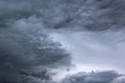 Dramatic thunderstorm clouds background at dark sky Stock Photos