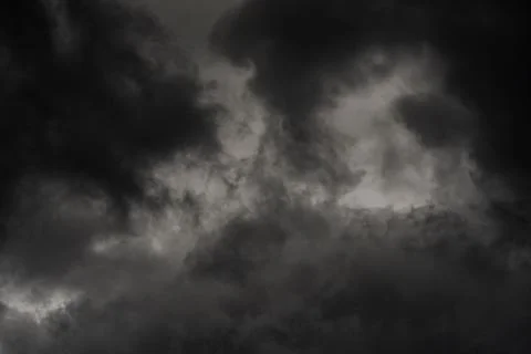 Dramatic thunderstorm clouds in dusk sky during rain. Natural cloudiness weather Stock Photos