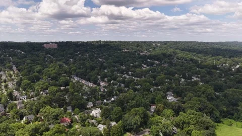 Dramatic tilt-down aerial from South Mountain horizon to Maplewood residential Stock Footage 344087568