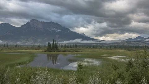 Dramatic Time-lapse of Canadian Rockies with Clouds and Lake Reflection Vídeo Stock 95380344