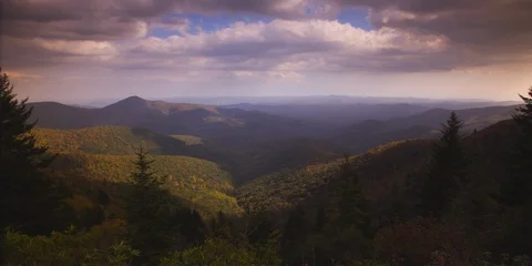 Dramatic time-lapse of clouds rolling over mountains  Video stock 103394711
