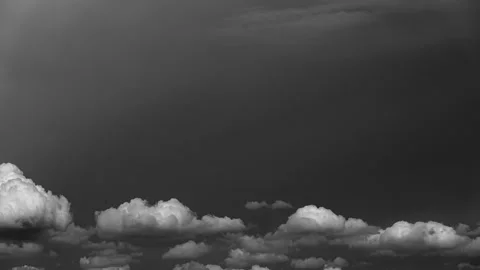 Dramatic time-lapse of cloudscapes, from fluffy white in a black sky Stock Footage 279207203