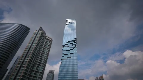 Dramatic time lapse of King Power Mahanakhon skysraper against flying clouds Stock Footage 155029837