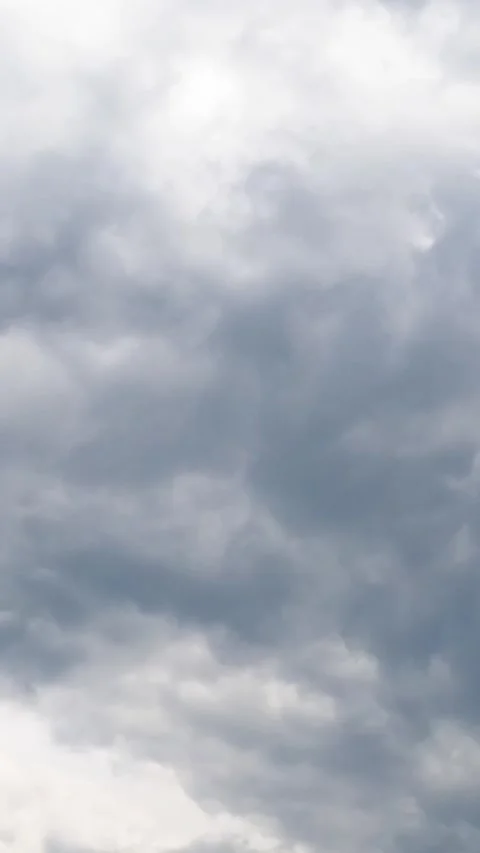 Dramatic time lapse motion of dark cumulus clouds gathering in a vast sky, .. Stock Footage 337519710