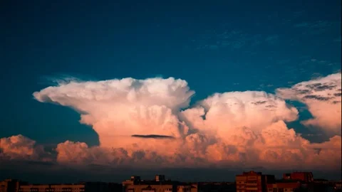Dramatic Time Lapse of Rising Cumulus Clouds over City Skyline at Sunset Stock Footage 331122057
