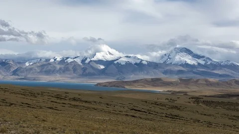 Dramatic Time-lapse of Snow-capped Holy Mountain and Lake in Tibet (Zoom in) Stock Footage 93377117