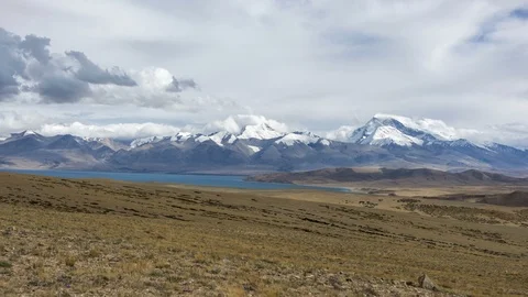 Dramatic Time-lapse of Snow-capped Holy Mountain and Lake in Tibet Stock Footage 93377139