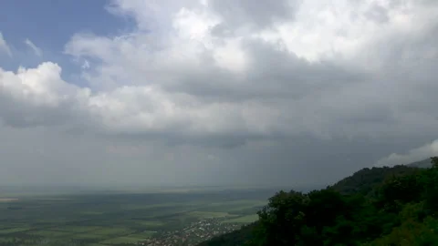 Dramatic time lapse of storm.Farmland field and hill Stock Footage 243386282