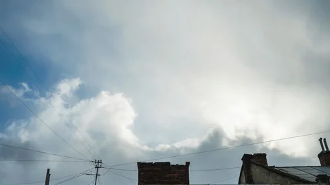 Dramatic time lapse, the sun is coming out of the clouds, 4K Stock Footage 124641756