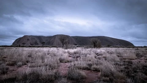 Dramatic time lapse video of clouds passing over Uluru/Ayers rock after rain 8K Stock Footage 130760605