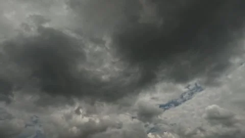 Dramatic timelapse of black clouds moving fast across the sky Stock Footage 321797797