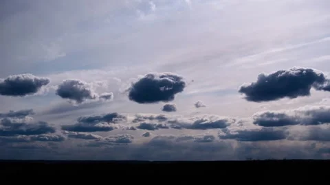 Dramatic Timelapse of Clouds Sweeping Over Dark Landscape Stock Footage 307208306