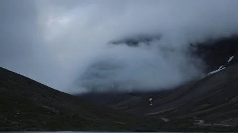 Dramatic timelapse of fast-moving clouds in the mountains Stock Footage 249417411