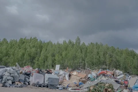 Dramatic timelapse of garbage dump with dark clouds Stock Footage 111408584