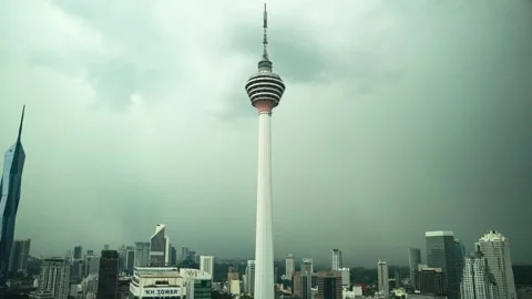 Dramatic Timelapse of Kuala Lumpur Tower Amidst a Rainy City Skyline Видео 331493821