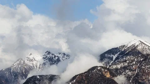 Dramatic Timelapse of Mountains with lots of Clouds Stock Footage 127188250