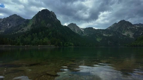 Dramatic Timelapse of Storm Clouds Above Estany de Sant Maurici Lake, Pyrenees Stockbeeldmateriaal 340569101