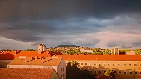 Dramatic Timelapse of Storm Clouds Over Eger at Sunset 4K Stock Footage 310469788