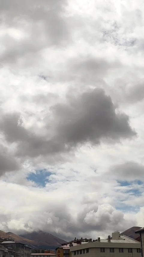 Dramatic timelapse-style shot of heavy grey and white clouds moving across the Stock-Footage 333240873