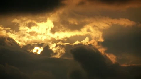 Dramatic timelapse of the sun covered by clouds at sunset Stock Footage 320029376