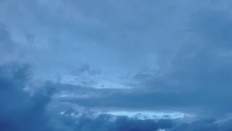 Dramatic timelapse of turbulent clouds with various shades of blue Stock Footage 321672371