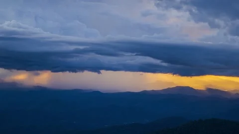 Dramatic timelapse zoom in of storm clouds over mountain range. Stock Footage 316657126