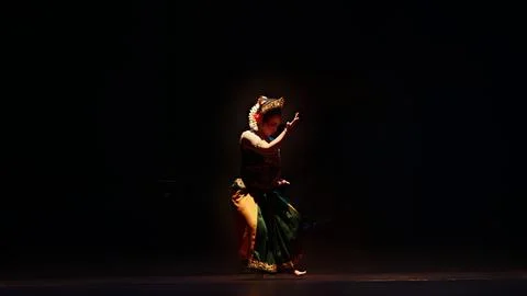 Dramatic Traditional Dancer Performing in Low Light Theater Stock Photos