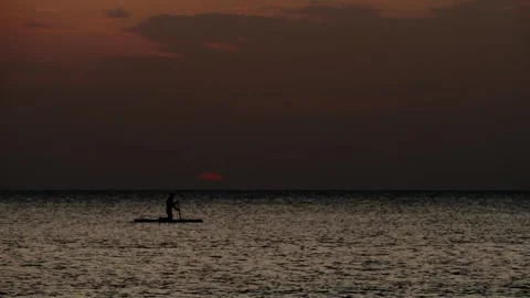 Dramatic tropical sunset with silhouette on SUP Stock Footage 331622014