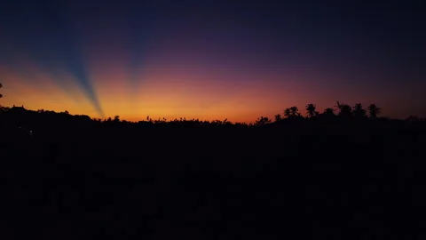 Dramatic Tropical Sunset With Sun Rays Stretching Across Colorful Evening Sky Ab Stock Footage 337053837