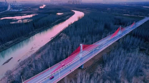 Dramatic Twilight Aerial of Modern Red Cable Bridge Over River Xi'an Shaanxi Stock-Footage 346933530