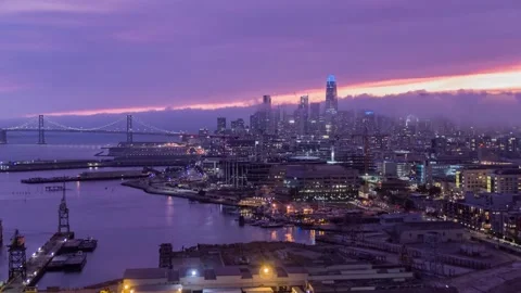 Dramatic Twilight Panorama of San Francisco Skyline and Bay Bridge under Pur Video stock 346904983