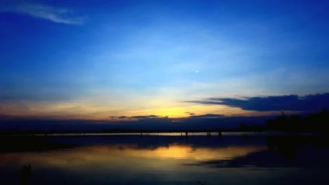 Dramatic Twilight Sky Over Calm Water Reflection Stock Footage 311529983