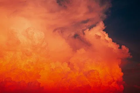 Dramatic twilight sky with vibrant orange sunset clouds Stock Photos