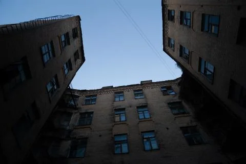 Dramatic underside view of dark building. Dangerous ghetto house. Stock Photos