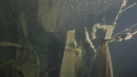 Dramatic underwater environment with plastic waste and nylons on the bottom Stock-Footage 254470760