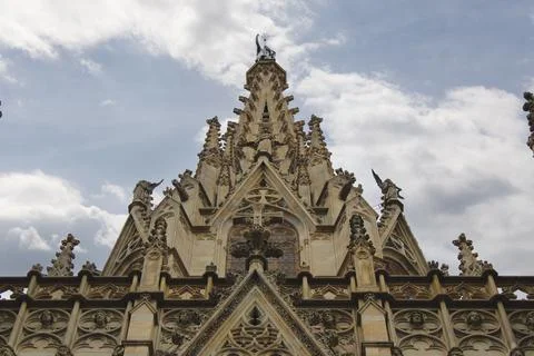 A dramatic upward view of an ornate Gothic cathedral facade Foto stock
