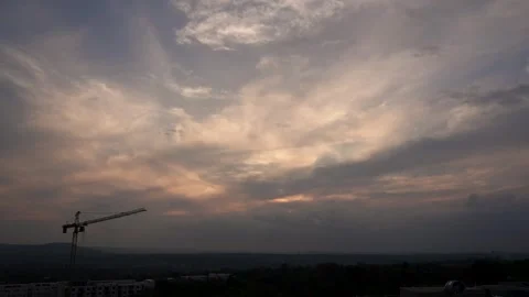 A Dramatic Urban 4K Timelapse of a the movement of clouds at sunset, Suburban Stock Footage 242941381