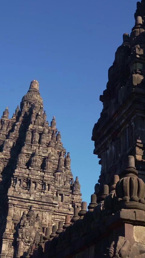 Dramatic vertical low-angle view captures ornate Prambanan Temple towers fr.. Stock Footage 341545569