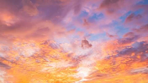 Dramatic vibrant color with beautiful cloud of sunrise and sunset on a cloudy Stock Photos
