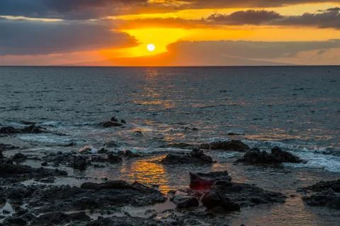 A dramatic vibrant sunset scenery in Maui, Hawaii Stock Photos