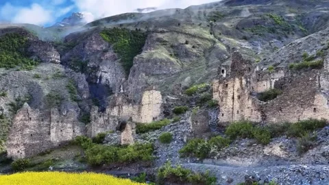 Dramatic View of Ancient Stone Fortifications Amidst Misty Mountains Tibet China Stock Footage 346737424