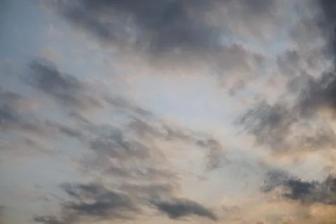 A dramatic view of a cloudy sky with thick layers of grey cumulus clouds Stock Photos
