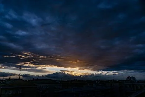 Dramatic view of dark clouds in the colorful sky during sunset Foto stock