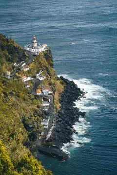 Dramatic view down to lighthouse on Ponta do Arnel, Nordeste, Sao Miguel Island Stock Photos