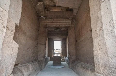 A dramatic view down a narrow dark granite-walled corridor inside the inner s Stock Photos