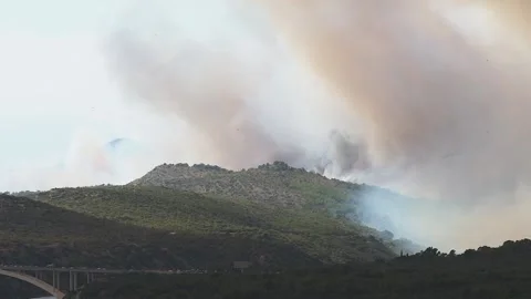 Dramatic view of fires raging over the town of Zaton in Croatia near Šibenik. Stock Footage 236006534