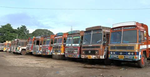 A Dramatic view of a Fleet of commercial trucks seen parked in Mysore. Stock Photos