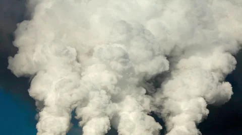 Dramatic view of of four smoke or steam columns with total clouds above. Stock Footage 38617131